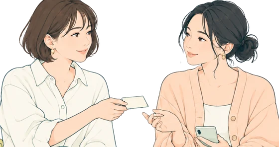顔を見合わせて話す2人。片方が小さなカードを手渡そうとしている